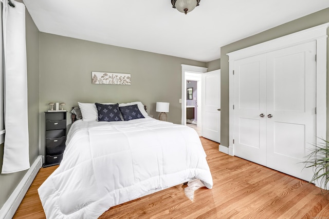 91 Bart Rd, Monroe, CT 06468 - bedroom with light wood-style floors, a closet, a baseboard radiator, and baseboards