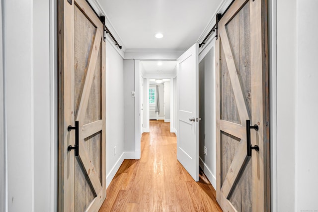 91 Bart Rd, Monroe, CT 06468 - hallway featuring a barn door, baseboards, light wood-style flooring, ornamental molding, and recessed lighting