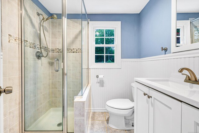 91 Bart Rd, Monroe, CT 06468 - full bathroom featuring toilet, vanity, a stall shower, a wainscoted wall, and tile patterned flooring