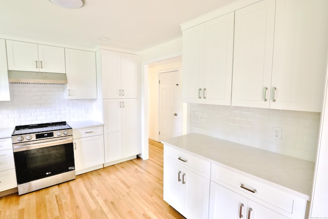 792 Cornwall Ave, Cheshire, CT 06410 - kitchen with stainless steel range oven, under cabinet range hood, light wood-type flooring, light countertops, and backsplash
