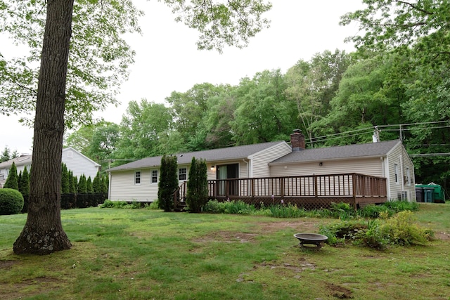 792 Cornwall Ave, Cheshire, CT 06410 - view of front of home featuring a fire pit, a deck, a front lawn, and a chimney