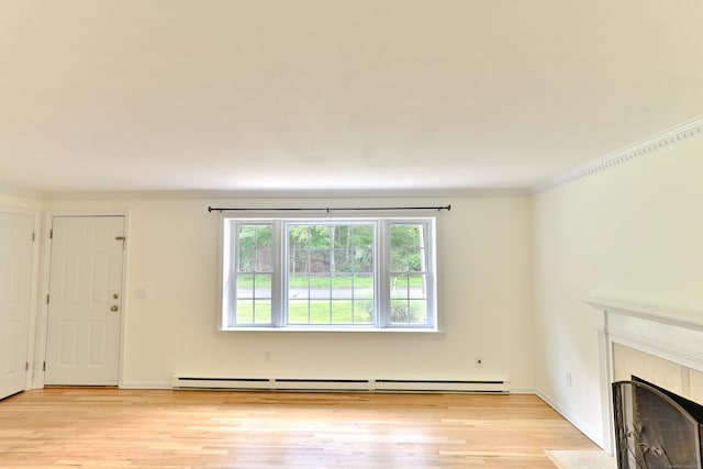 792 Cornwall Ave, Cheshire, CT 06410 - unfurnished living room with a tiled fireplace, light wood-style floors, crown molding, baseboard heating, and baseboards