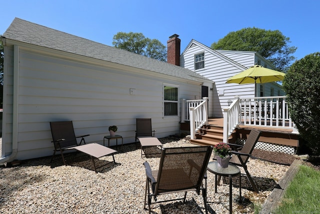 110 Cottage St, Trumbull, CT 06611 - rear view of property featuring roof with shingles, a chimney, and a deck