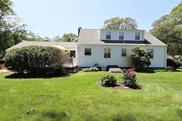 110 Cottage St, Trumbull, CT 06611 - rear view of property with a wooden deck, a lawn, a shingled roof, and a chimney