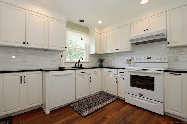 110 Cottage St, Trumbull, CT 06611 - kitchen featuring white appliances, a sink, under cabinet range hood, dark countertops, and white cabinetry