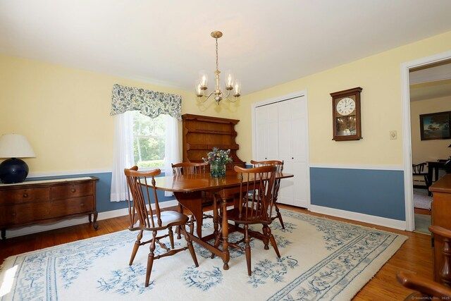 110 Cottage St, Trumbull, CT 06611 - dining room featuring a chandelier and wood finished floors