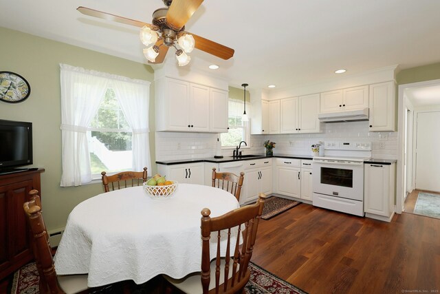 110 Cottage St, Trumbull, CT 06611 - kitchen featuring white range with electric cooktop, under cabinet range hood, a sink, a ceiling fan, and white cabinetry