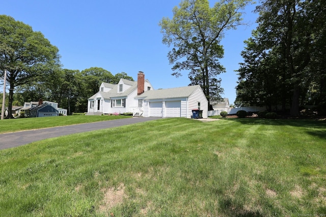 110 Cottage St, Trumbull, CT 06611 - cape cod-style house with a chimney, a front lawn, and asphalt driveway