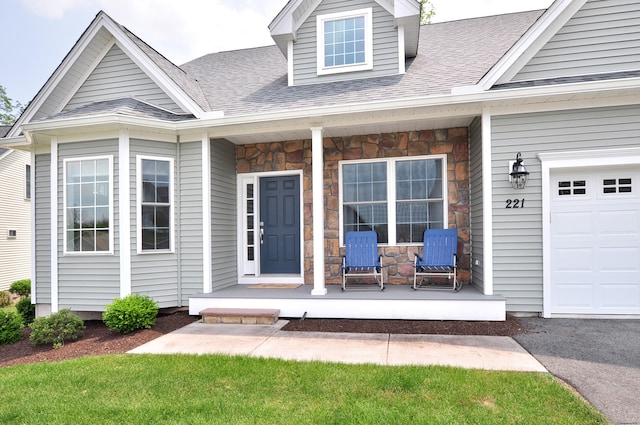 221 Scenic Dr Unit 221, Berlin, CT 06037 - property entrance with a porch, stone siding, and roof with shingles
