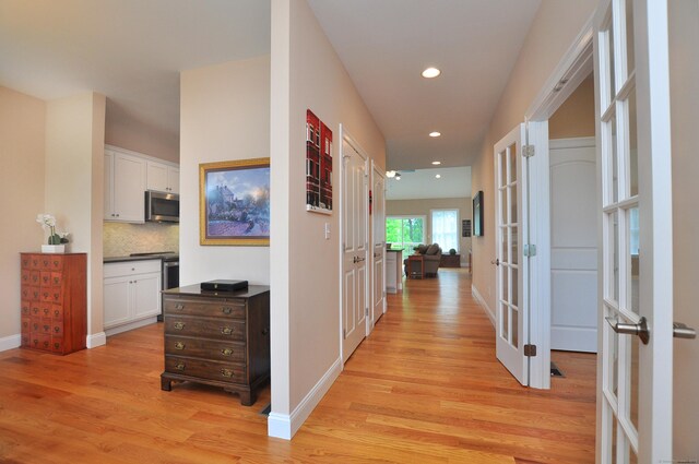 221 Scenic Dr Unit 221, Berlin, CT 06037 - hallway featuring french doors, light wood-style floors, and recessed lighting