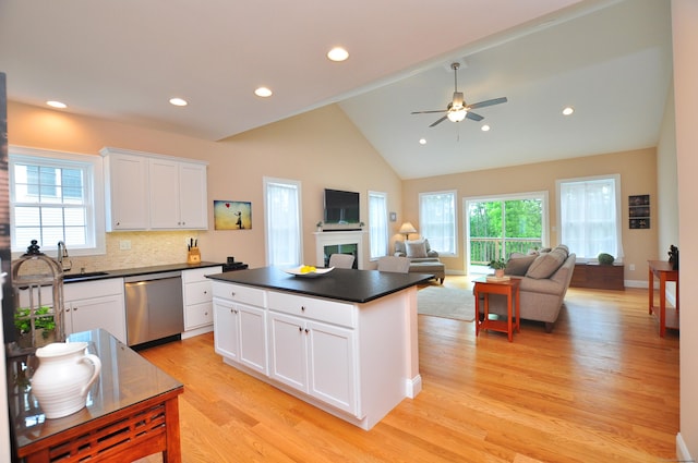221 Scenic Dr Unit 221, Berlin, CT 06037 - kitchen featuring stainless steel dishwasher, dark countertops, light wood-type flooring, white cabinets, and a ceiling fan
