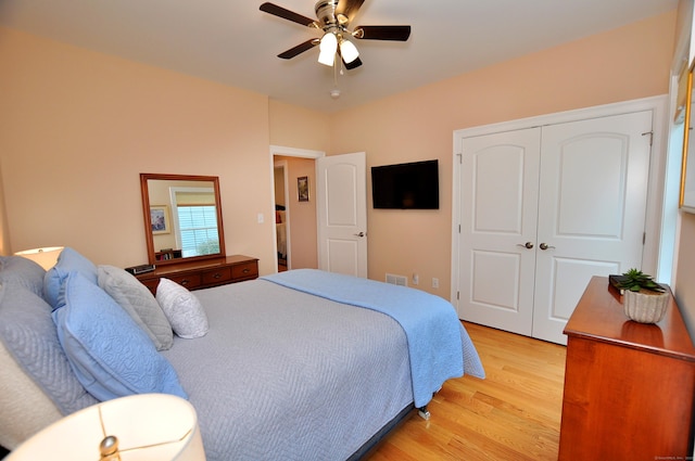221 Scenic Dr Unit 221, Berlin, CT 06037 - bedroom with light wood-type flooring, a closet, and ceiling fan