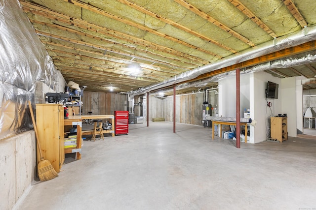 221 Scenic Dr Unit 221, Berlin, CT 06037 - unfinished below grade area with gas water heater and a workshop area