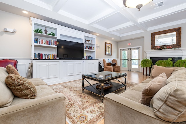 237 Fern St Apt 206W, West Hartford, CT 06119 - living area with coffered ceiling, beamed ceiling, french doors, light wood finished floors, and a wainscoted wall