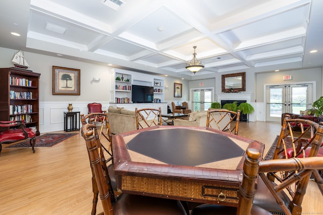 237 Fern St Apt 206W, West Hartford, CT 06119 - dining space with light wood-style floors, coffered ceiling, beamed ceiling, wainscoting, and french doors