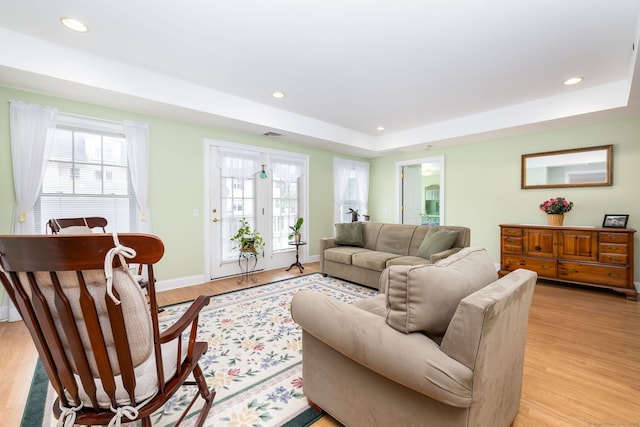 237 Fern St Apt 206W, West Hartford, CT 06119 - living room with plenty of natural light, light wood-type flooring, recessed lighting, a raised ceiling, and baseboards