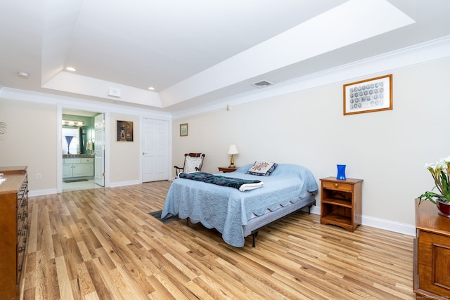 237 Fern St Apt 206W, West Hartford, CT 06119 - bedroom with light wood-style floors, a raised ceiling, recessed lighting, crown molding, and baseboards