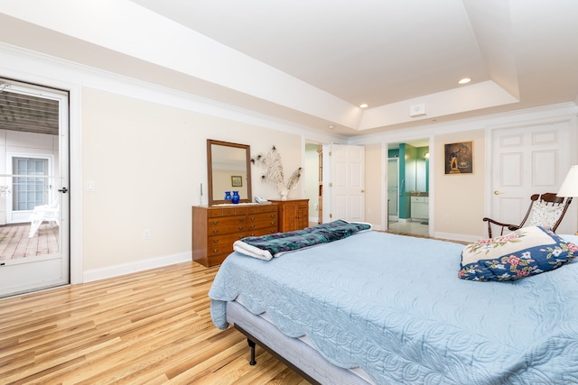 237 Fern St Apt 206W, West Hartford, CT 06119 - bedroom featuring a tray ceiling, light wood-type flooring, recessed lighting, baseboards, and ensuite bath