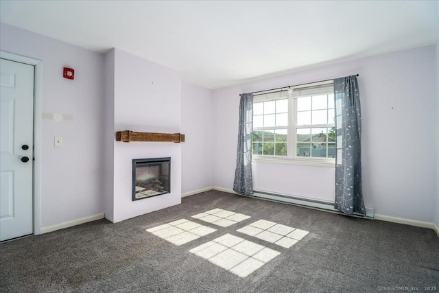 12 Terrace Pl Unit 12, New Milford, CT 06776 - unfurnished living room with carpet floors, a glass covered fireplace, a baseboard heating unit, and baseboards