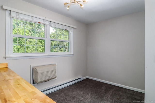 12 Terrace Pl Unit 12, New Milford, CT 06776 - unfurnished room with a baseboard heating unit, a chandelier, baseboards, and carpet flooring