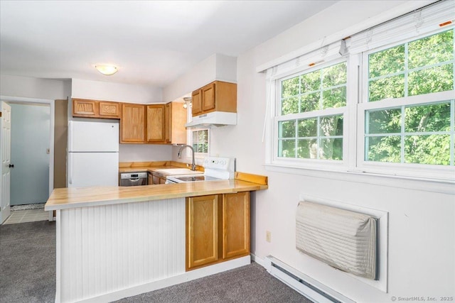 12 Terrace Pl Unit 12, New Milford, CT 06776 - kitchen featuring white appliances, light countertops, a peninsula, and brown cabinetry