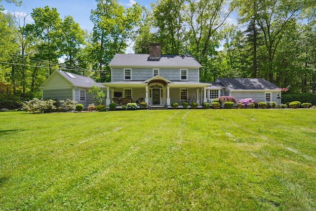 6 Downe Ln, Wilton, CT 06897 - view of front of home featuring a chimney, a front lawn, and a porch