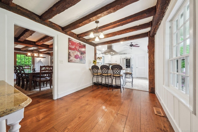 6 Downe Ln, Wilton, CT 06897 - dining room featuring a chandelier, beamed ceiling, hardwood / wood-style floors, ceiling fan, and baseboards