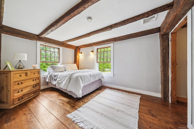 6 Downe Ln, Wilton, CT 06897 - bedroom with hardwood / wood-style flooring, multiple windows, baseboards, and beamed ceiling