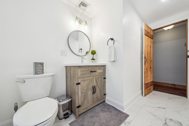6 Downe Ln, Wilton, CT 06897 - bathroom featuring marble finish flooring, vanity, toilet, and baseboards