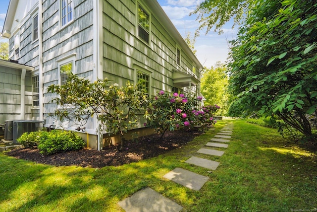 6 Downe Ln, Wilton, CT 06897 - view of property exterior featuring cooling unit and a lawn