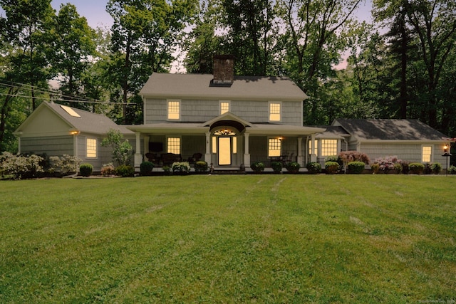 6 Downe Ln, Wilton, CT 06897 - view of front of house featuring a chimney, a porch, and a lawn