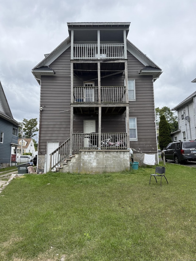 290 Ridgefield Ave, Bridgeport, CT 06610 - rear view of property featuring a balcony and a lawn