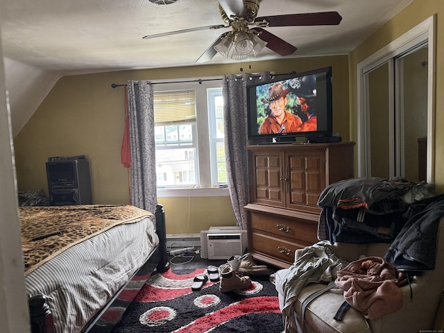290 Ridgefield Ave, Bridgeport, CT 06610 - bedroom with vaulted ceiling, a ceiling fan, a wall mounted air conditioner, and baseboards