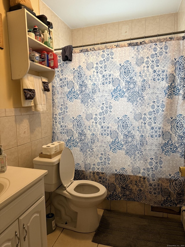 290 Ridgefield Ave, Bridgeport, CT 06610 - full bath featuring tile patterned flooring, tile walls, toilet, vanity, and a shower with shower curtain