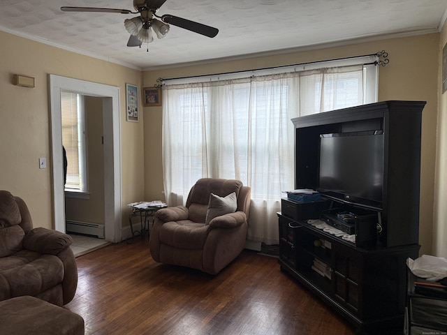 290 Ridgefield Ave, Bridgeport, CT 06610 - living room with a baseboard heating unit, dark wood-style floors, ceiling fan, and crown molding