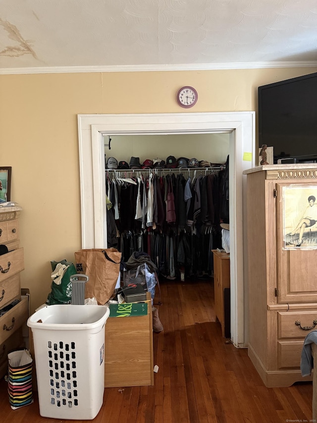 290 Ridgefield Ave, Bridgeport, CT 06610 - bedroom with a closet, wood-type flooring, and crown molding