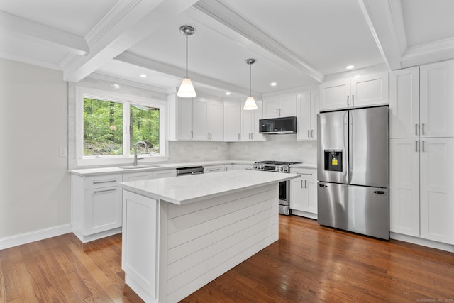 73 Nedobity Rd, Haddam, CT 06441 - kitchen with appliances with stainless steel finishes, a sink, beamed ceiling, backsplash, and crown molding