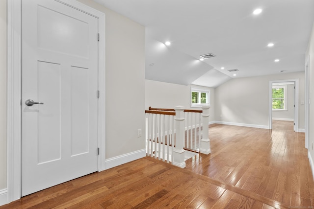 73 Nedobity Rd, Haddam, CT 06441 - corridor featuring an upstairs landing, light wood-style flooring, healthy amount of natural light, baseboards, and vaulted ceiling