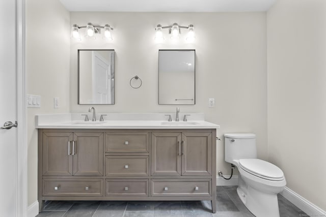 73 Nedobity Rd, Haddam, CT 06441 - full bathroom with double vanity, toilet, baseboards, and tile patterned floors