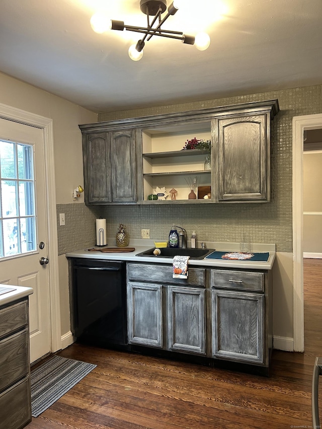 146 Knowlton St, Stratford, CT 06615 - bar with black dishwasher, dark wood-style flooring, a sink, backsplash, and baseboards