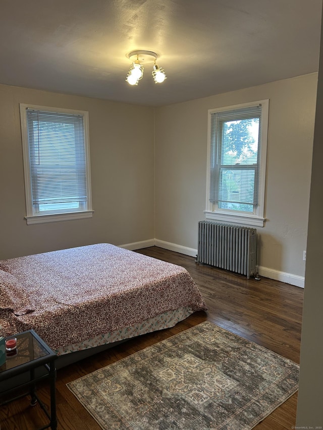 146 Knowlton St, Stratford, CT 06615 - bedroom with radiator heating unit, wood finished floors, and baseboards