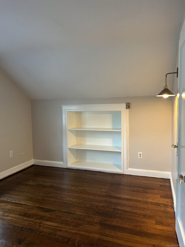 146 Knowlton St, Stratford, CT 06615 - unfurnished room with dark wood-style floors, baseboards, and built in features