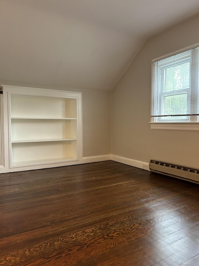 146 Knowlton St, Stratford, CT 06615 - bonus room featuring a baseboard radiator, lofted ceiling, dark wood-style flooring, built in shelves, and baseboards