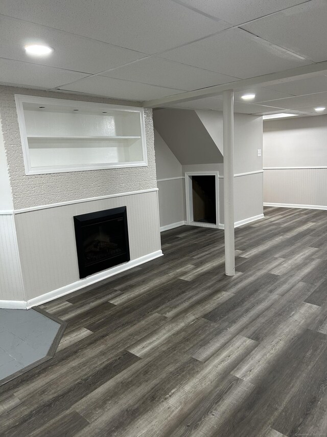 146 Knowlton St, Stratford, CT 06615 - unfurnished living room featuring wood finished floors, a fireplace, wainscoting, and recessed lighting