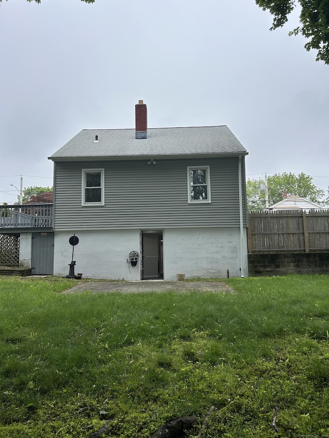 146 Knowlton St, Stratford, CT 06615 - rear view of house featuring a chimney