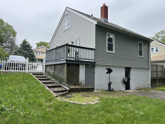 146 Knowlton St, Stratford, CT 06615 - back of property with a wooden deck, a chimney, and stairway
