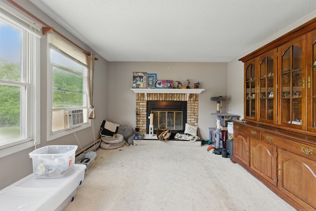 23 Fenwick Ct, Groton, CT 06355 - living room featuring a brick fireplace, cooling unit, a baseboard heating unit, and carpet