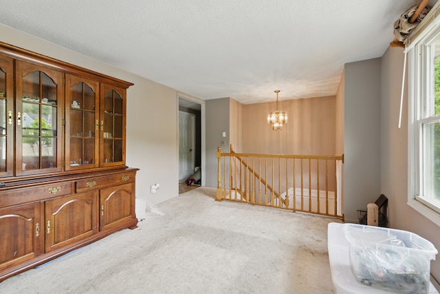 23 Fenwick Ct, Groton, CT 06355 - carpeted empty room featuring a chandelier