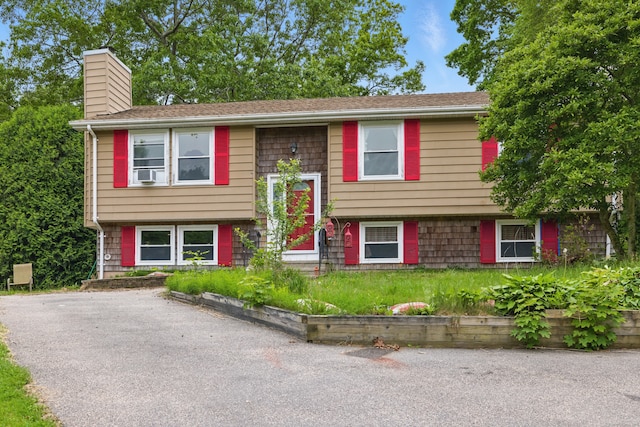 23 Fenwick Ct, Groton, CT 06355 - split foyer home featuring a chimney and cooling unit