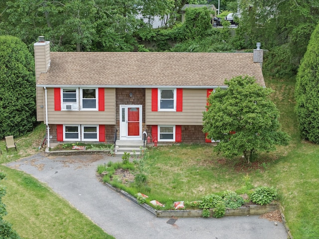 23 Fenwick Ct, Groton, CT 06355 - split foyer home with a chimney, a shingled roof, and driveway